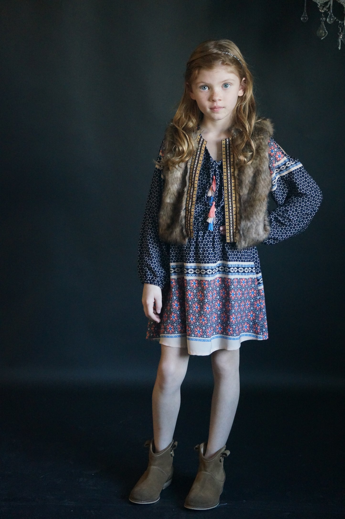 SLEEVELESS FAUX FUR VEST WITH CONTRAST PRINT LINING AND CONTRAST NAVAJO TRIM