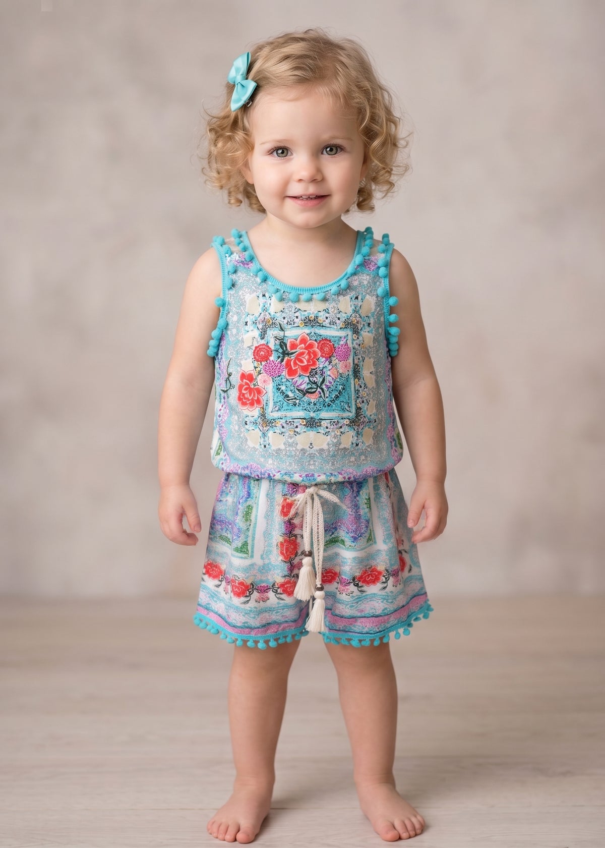 FLORAL PRINT ROMPER WITH POMPOM TRIM DETAIL AND LACE-UP BACK