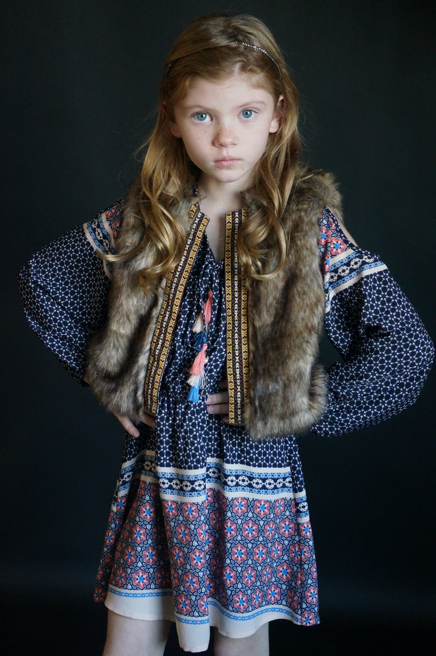 SLEEVELESS FAUX FUR VEST WITH CONTRAST PRINT LINING AND CONTRAST NAVAJO TRIM