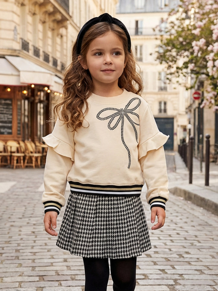 RUFFLE TOP WITH CONTRAST RHINESTONE BOW DETAIL