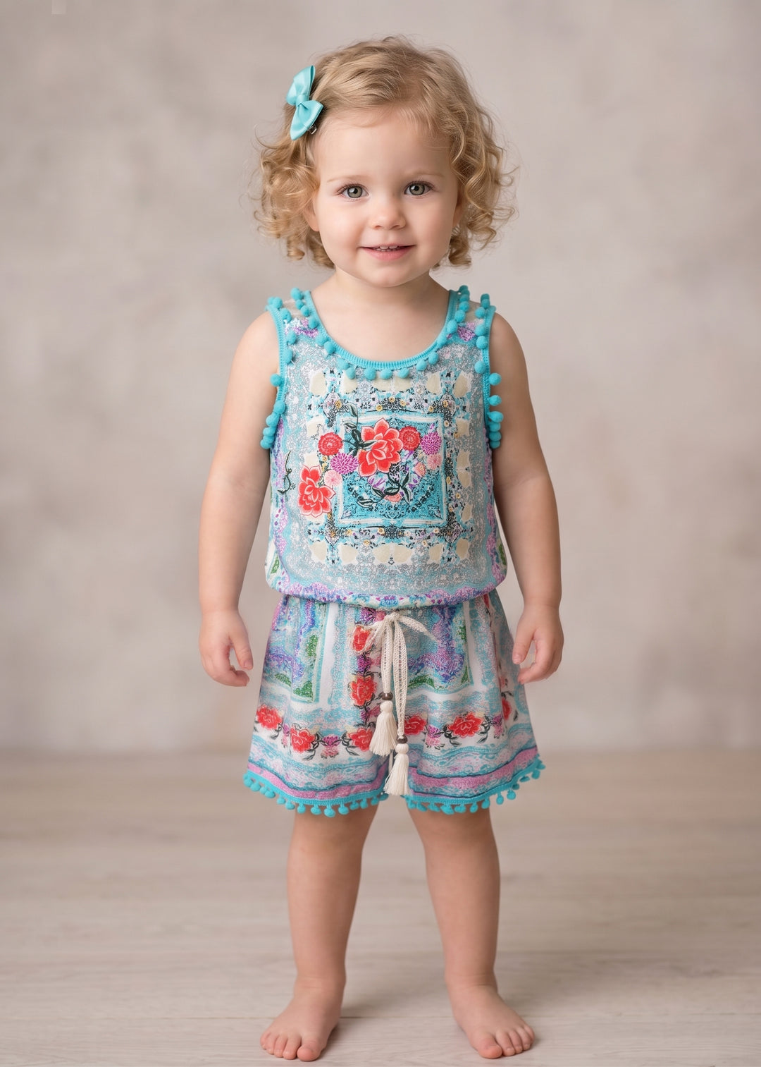 FLORAL PRINT ROMPER WITH POMPOM TRIM DETAIL AND LACE-UP BACK