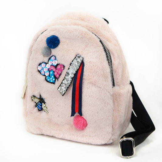 PINK FAUX FUR BACKPACK WITH PATCH HEARTS, A BEE AND POM POMS.