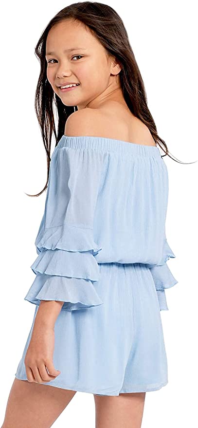 Big Girls Ruffle Sleeve Baby Blue Romper  Ruffled Elastic Boat Neck (Can be work on of off the shoulder!)  3/4 Tiered Ruffle Sleeves  Drawstring Tassel Tie Waistline   The perfect romper for all seasons.  SELF: 100% Rayon, LINING: 100% Polyester  Rayon gauze fabrication with soft hand-feel.