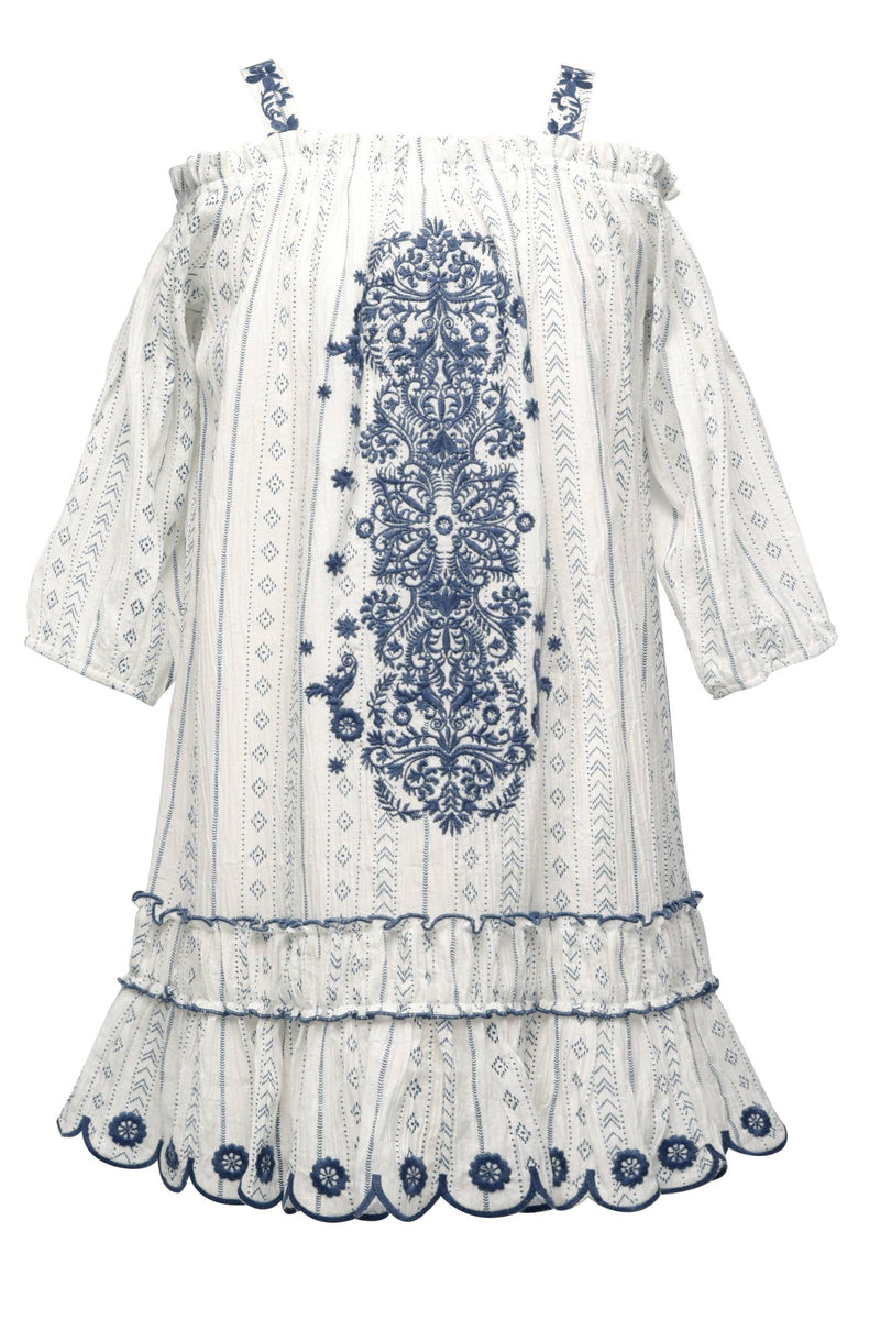 My Hannah Banana Girl’s Off The Shoulder Scallop Hem Embroidered Boho Dress.  Square Neckline Semi Thick Straps W/ Embroidered Details  Cold Shoulder  Large Boho Statement Embroidery Running Down Chest  Tunic Style Fit For Comfort   All Over Bohemian Print  Scalloped Eyelet Detail Lower Hem Small Ruffled Details On Off Shoulder Area & Lower Skirt Portion Imported