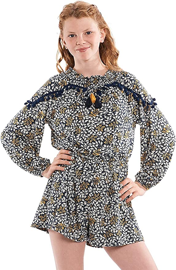 Big Girl Leaf Boho Pom Pom Tassel Romper  Round Ruffled Neckline  Pom Pom & Tassel Trim on Chest & Shoulders   Long Sleeves  Elastic Waistline  Perfect Tones for Transitional Fall/Winter   SELF: 94% Polyester / 6% Spandex, LINING: 100% Polyester  Easy and comfortable long sleeve knit romper. Comes in high quality knit printed with navy multicolor floral print. Lined for her comfort.  Embellished with navy pompom trim and colorful navy and yellow contrast tassel ties. 