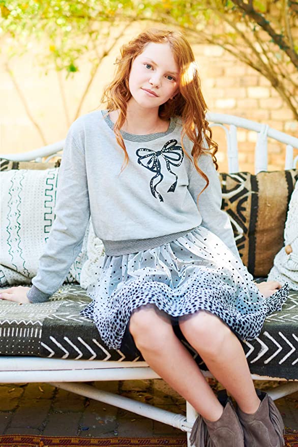 Big Girls Bow Polka Dot Twofer Dress  Rounded/Semi Boat Neckline  Long Sleeves  Stripe Contrast Trim on Neck, Cuffs, and Hem  Bow Rhinestone Graphic Print on Chest  Color Block Gradient Polka Dot  Lined Interior Skirt  A Perfect Everyday Dress or Semi Dressy.   