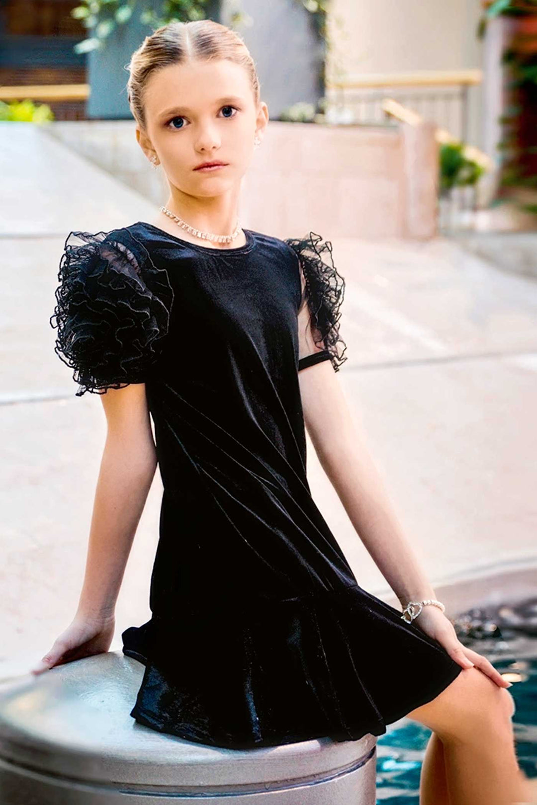 Girls Mesh Frill Short Sleeve Velvet Dress Round neckline, easy pullover design Beautiful mesh frill 3D flower-shaped short sleeves Soft comfy velvet fabrication, perfect for the fall-winter holiday season Right above the knee length Imported SELF: 95% Polyester / 5% Spandex Sleeveless skater dress in high quality scuba. One-of-a-kind artwork with floral and butterfly graphics done with sublimation printing.