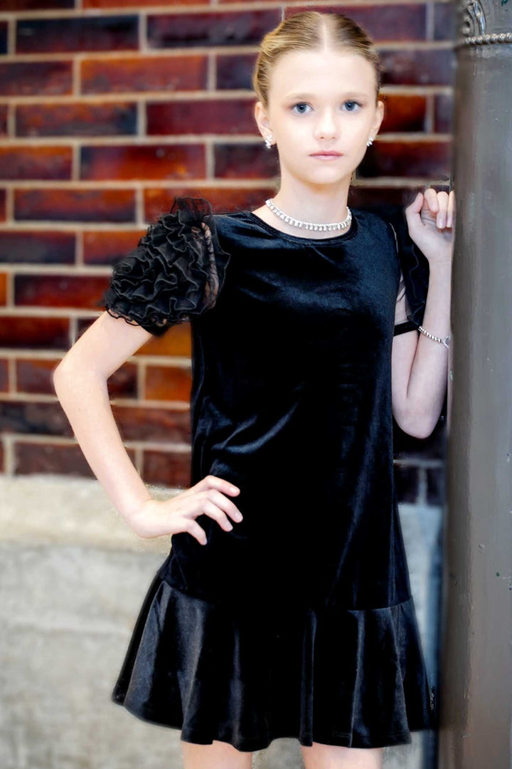 Girls Mesh Frill Short Sleeve Velvet Dress Round neckline, easy pullover design Beautiful mesh frill 3D flower-shaped short sleeves Soft comfy velvet fabrication, perfect for the fall-winter holiday season Right above the knee length Imported SELF: 95% Polyester / 5% Spandex Sleeveless skater dress in high quality scuba. One-of-a-kind artwork with floral and butterfly graphics done with sublimation printing.