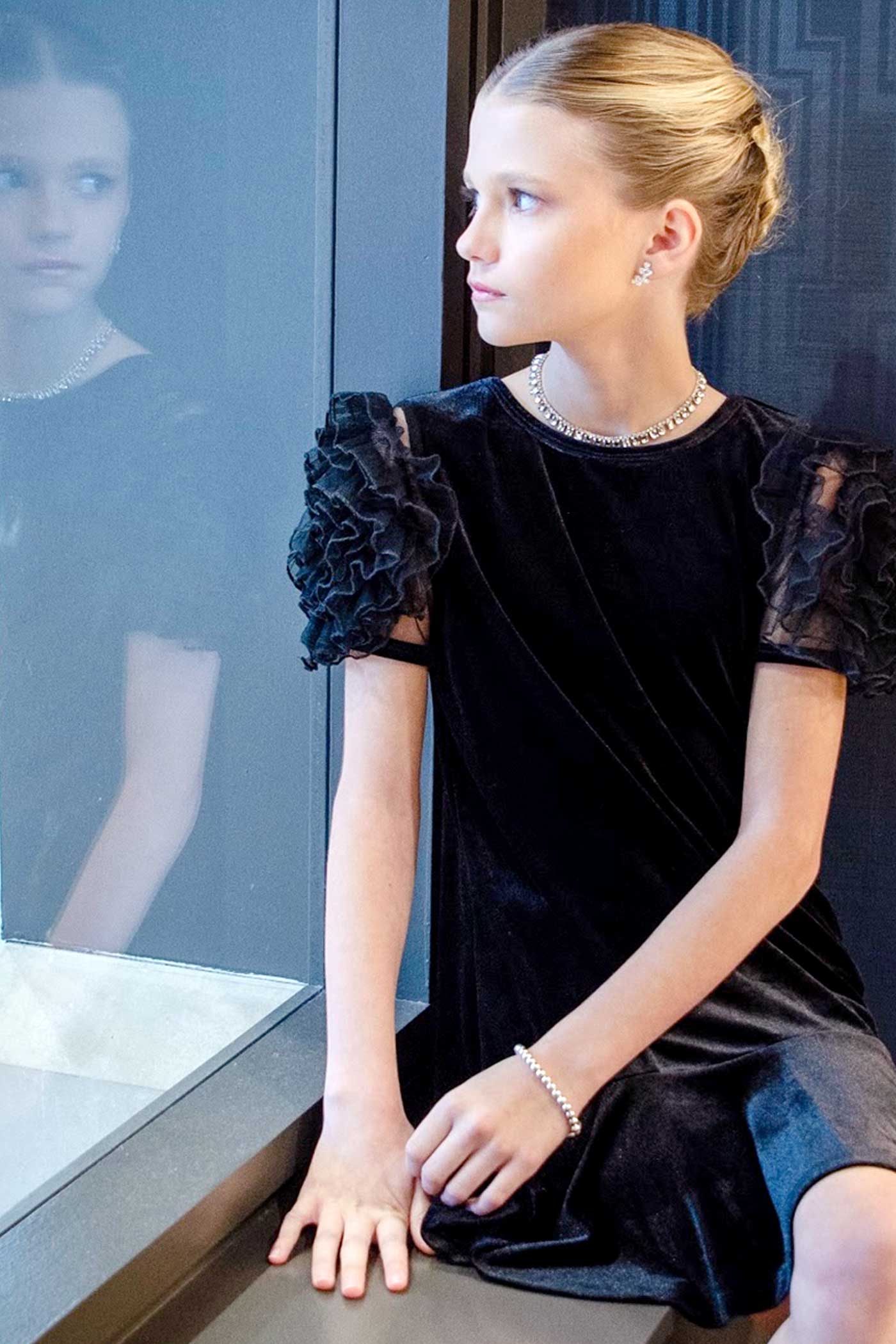 Girls Mesh Frill Short Sleeve Velvet Dress Round neckline, easy pullover design Beautiful mesh frill 3D flower-shaped short sleeves Soft comfy velvet fabrication, perfect for the fall-winter holiday season Right above the knee length Imported SELF: 95% Polyester / 5% Spandex Sleeveless skater dress in high quality scuba. One-of-a-kind artwork with floral and butterfly graphics done with sublimation printing