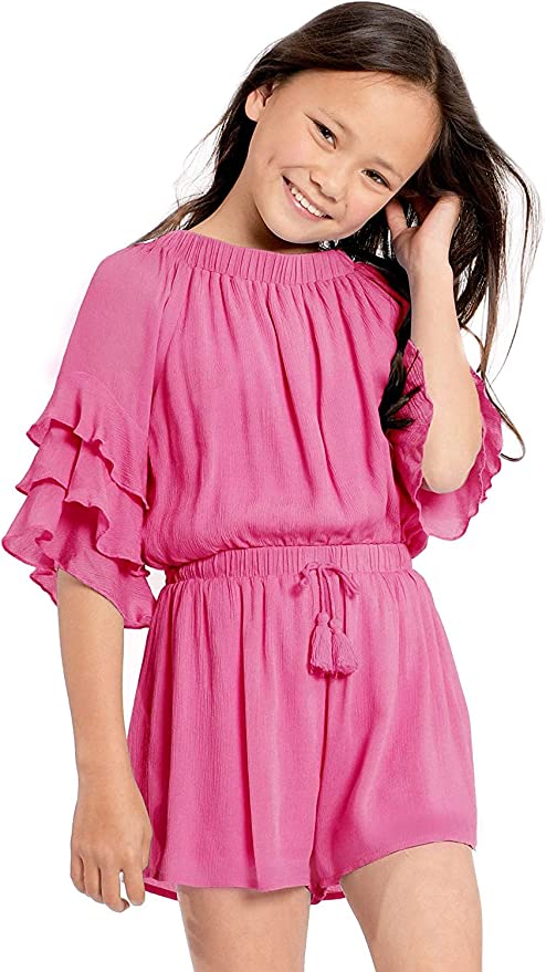 Big Girls Ruffle Sleeve Baby Blue Romper  Ruffled Elastic Boat Neck (Can be work on of off the shoulder!)  3/4 Tiered Ruffle Sleeves  Drawstring Tassel Tie Waistline   The perfect romper for all seasons.  SELF: 100% Rayon, LINING: 100% Polyester  A versatile romper that can be worn on and off the shoulder. Made in high quality rayon gauze fabrication. Lining is a super soft lightweight knit.