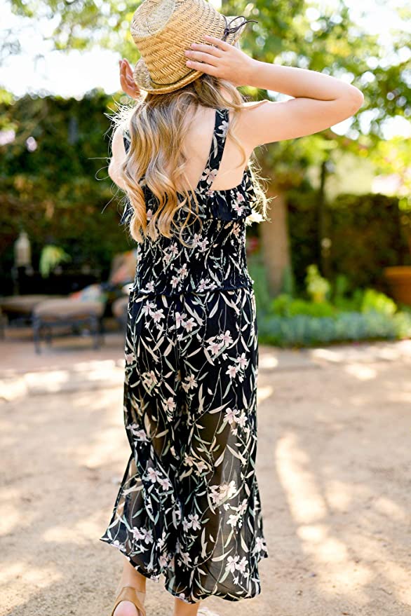 Big Girls Ruffle Floral Split Leg Jumpsuit  Scoop Neckline  Sleeveless  Ruffled Bust-line  Tortoise Shell Buttons  Smocked Mid Section With Lettuce Ruffle  Cropped Split Leg   A Great jumpsuit for All Seasons: Spring, Summer, Fall, and Winter.  The Perfect Jumpsuit to wear as is or layer up for colder seasons. 