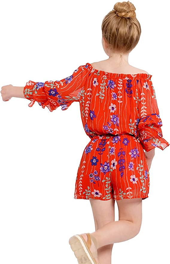 Big Girls Ruffle Sleeve Floral Print Romper  Ruffled Elastic Boat Neck (Can be work on of off the shoulder!)  3/4 Tiered Ruffle Sleeves  Burgundy, Pink, and White Floral Print  Drawstring Tassel Tie Waistline   The perfect romper for all seasons.  100% Polyester  SELF: 100% Polyester, LINING: 100% Polyester  Versatile romper that can be worn on and off the shoulder. Comes in a high quality chiffon fabrication. Super soft knit lining included.