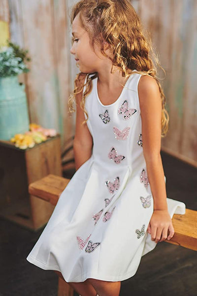Little I Big Girls Shimmer Butterfly Skater Dress  Scoop Neckline  Sleeveless  Shimmered Flying Butterflies  Skater Dress Fit   Exposed Back Zipper  Above Knee Length  Let her sparkle through the crowd in these dresses! School has started, so let these be her go-to-dresses at her school dance or best friend's birthday party!  Hannah Banana designer girls' special occasion dresses created with your little girl in mind.