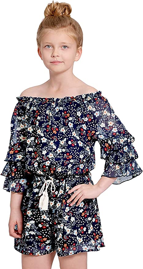Big Girls Ruffle Sleeve Floral Print Romper  Ruffled Elastic Boat Neck (Can be work on of off the shoulder!)  3/4 Tiered Ruffle Sleeves  Burgundy, Pink, and White Floral Print  Drawstring Tassel Tie Waistline   The perfect romper for all seasons.  SELF: 100% Polyester, LINING: 100% Polyester
