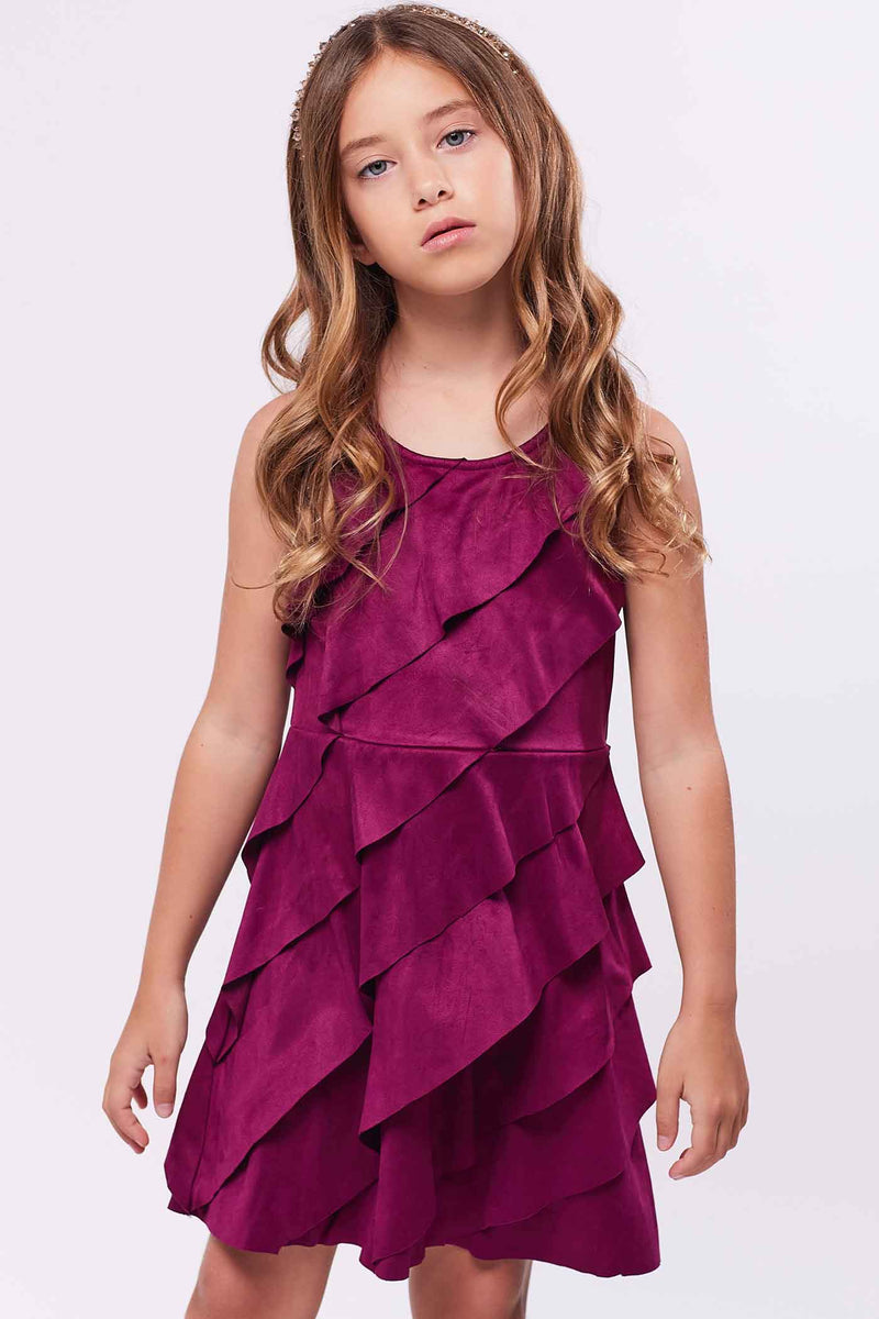 Girls Asymmetrical Ruffle Tiered Sleeveless Suede Dress Round neck Stylish asymmetrical ruffle highlighted design Back zipper closure Fancy faux suede fabrication Right above the knee length Perfect dress for fall or winter holiday festivities.  Imported