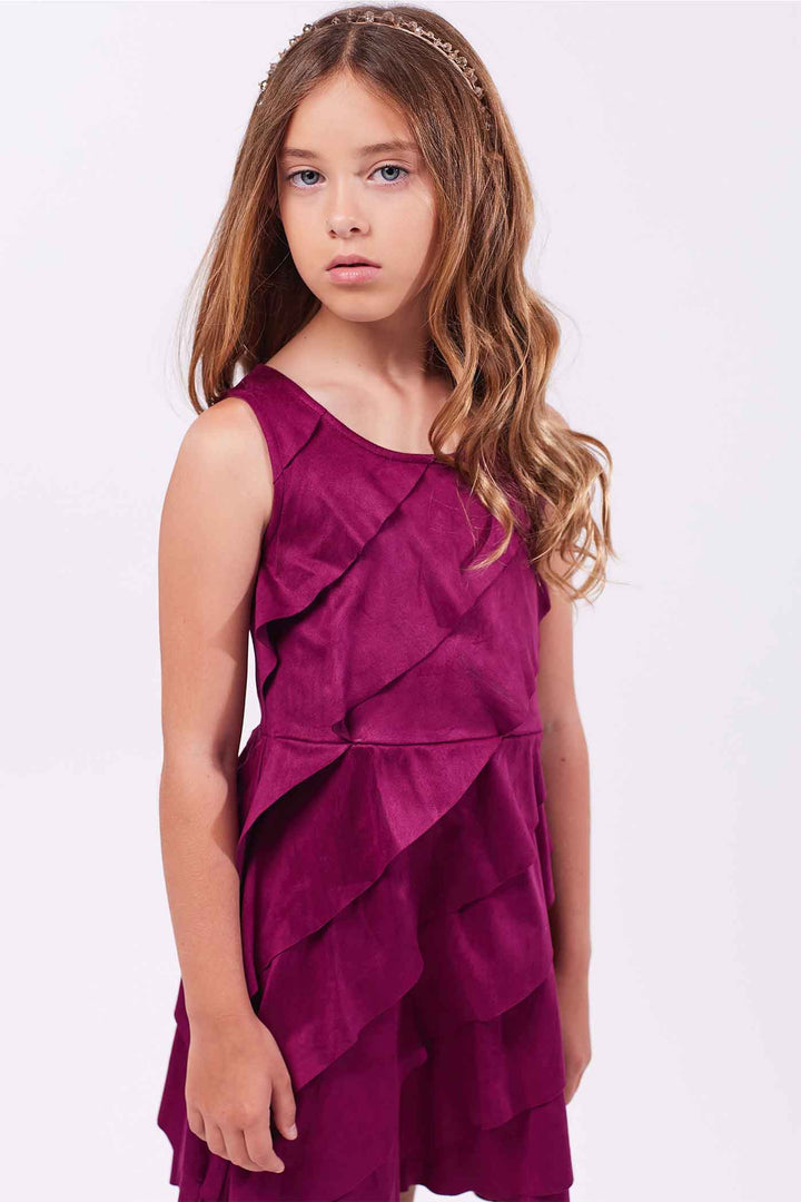 Girls Asymmetrical Ruffle Tiered Sleeveless Suede Dress Round neck Stylish asymmetrical ruffle highlighted design Back zipper closure Fancy faux suede fabrication Right above the knee length Perfect dress for fall or winter holiday festivities.  Imported